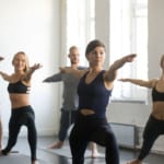 assisting yoga students